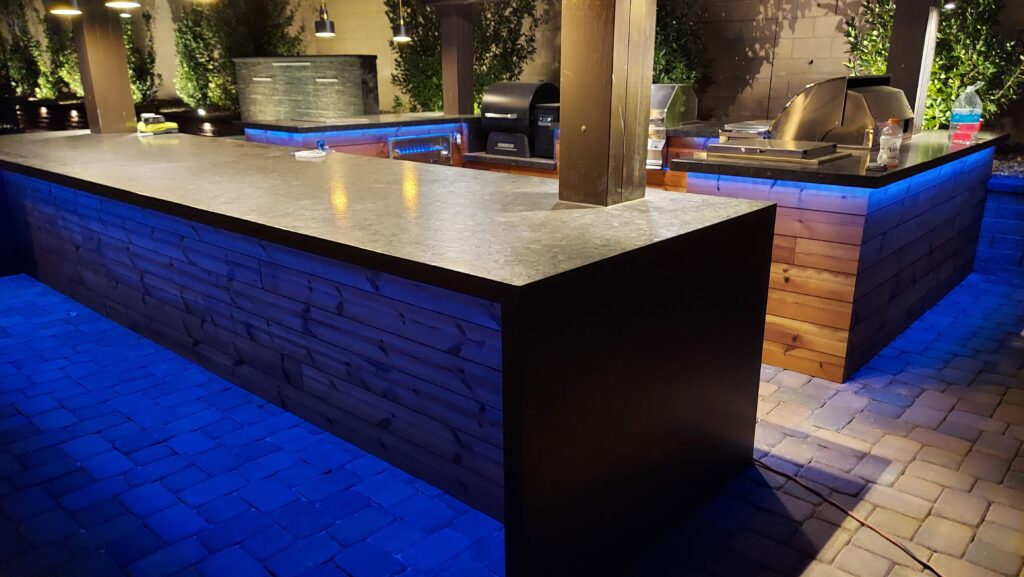 outdoor kitchen Thermory wood finish granite counter