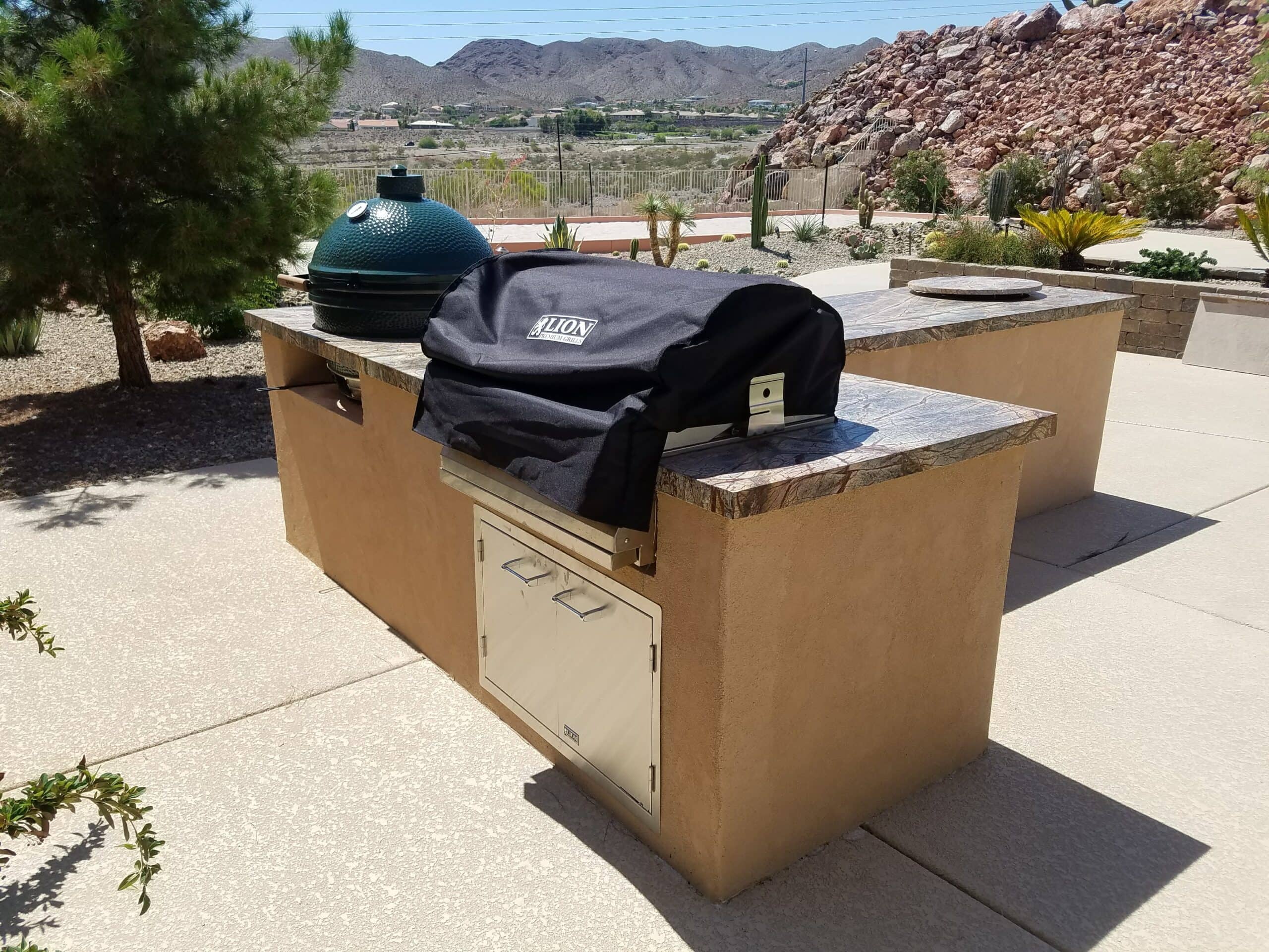 Outdoor kitchen island with a built-in Green Egg kamado smoker in Las Vegas
