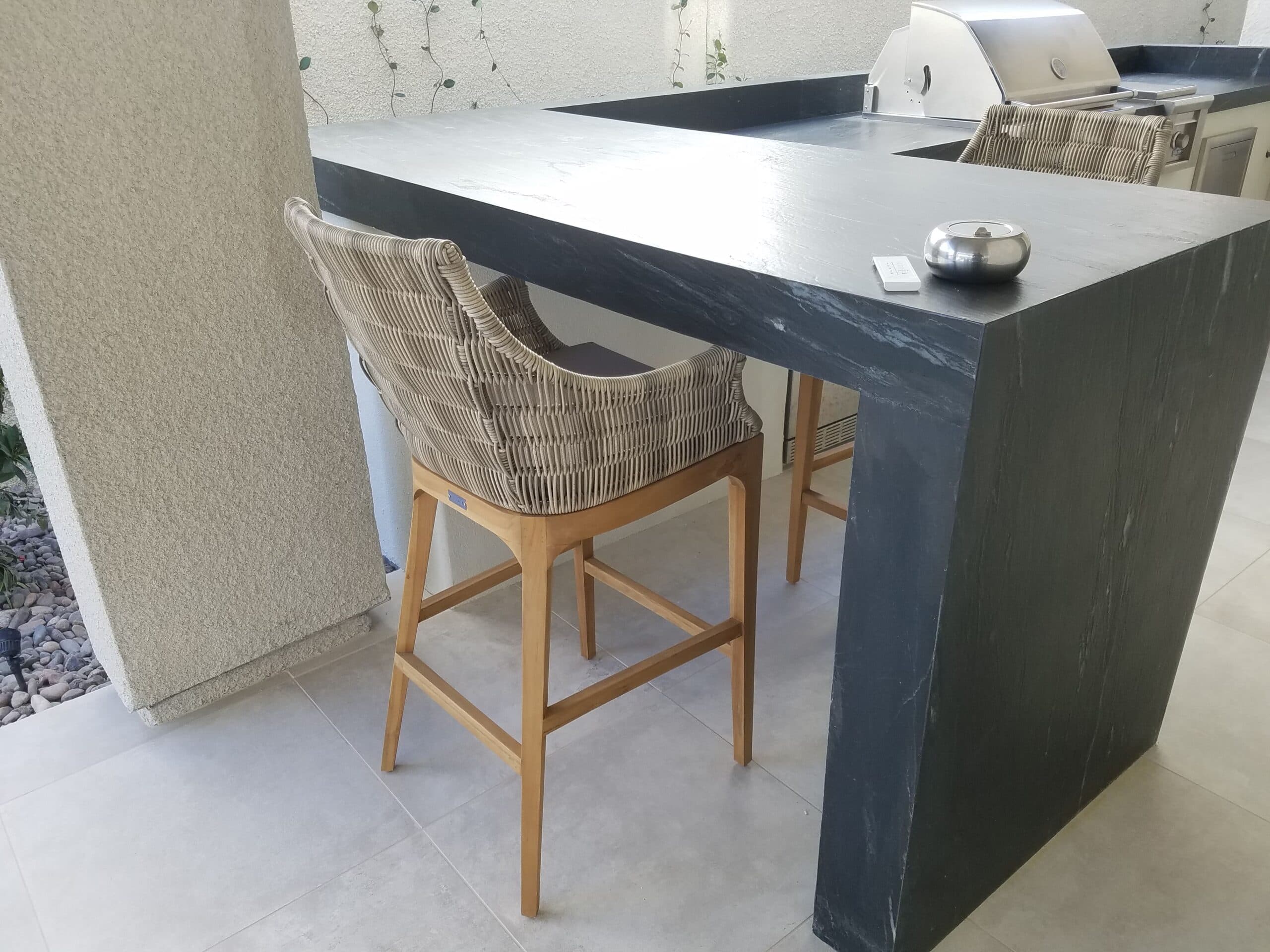 Bar stool seating detail at a modern outdoor kitchen island in Las Vegas