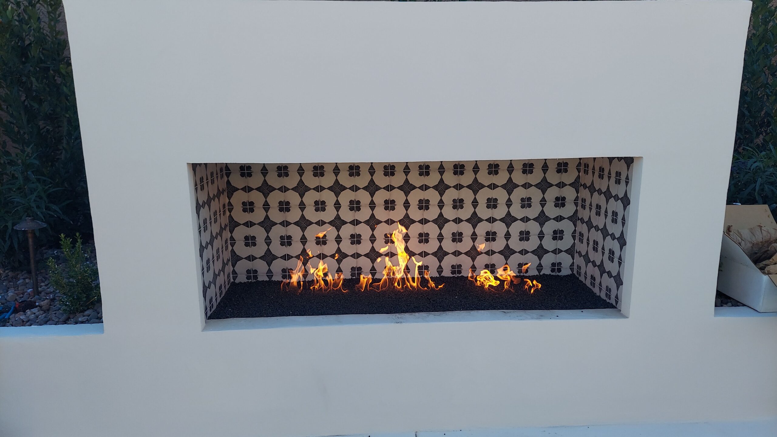 Custom linear outdoor fireplace with fire glass in Las Vegas