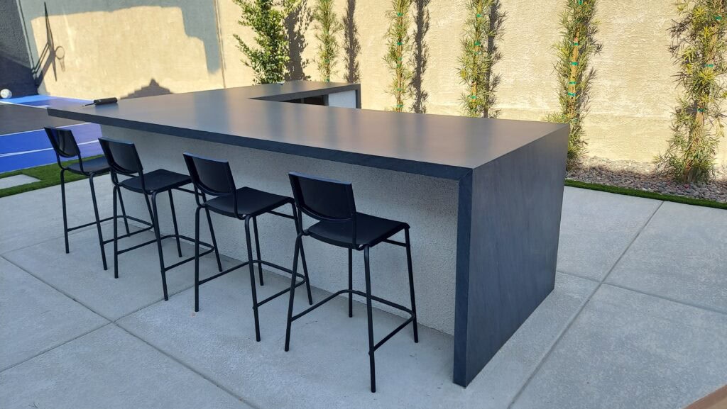 Modern outdoor bar with seating built by Sun West Outdoor Kitchens in Las Vegas