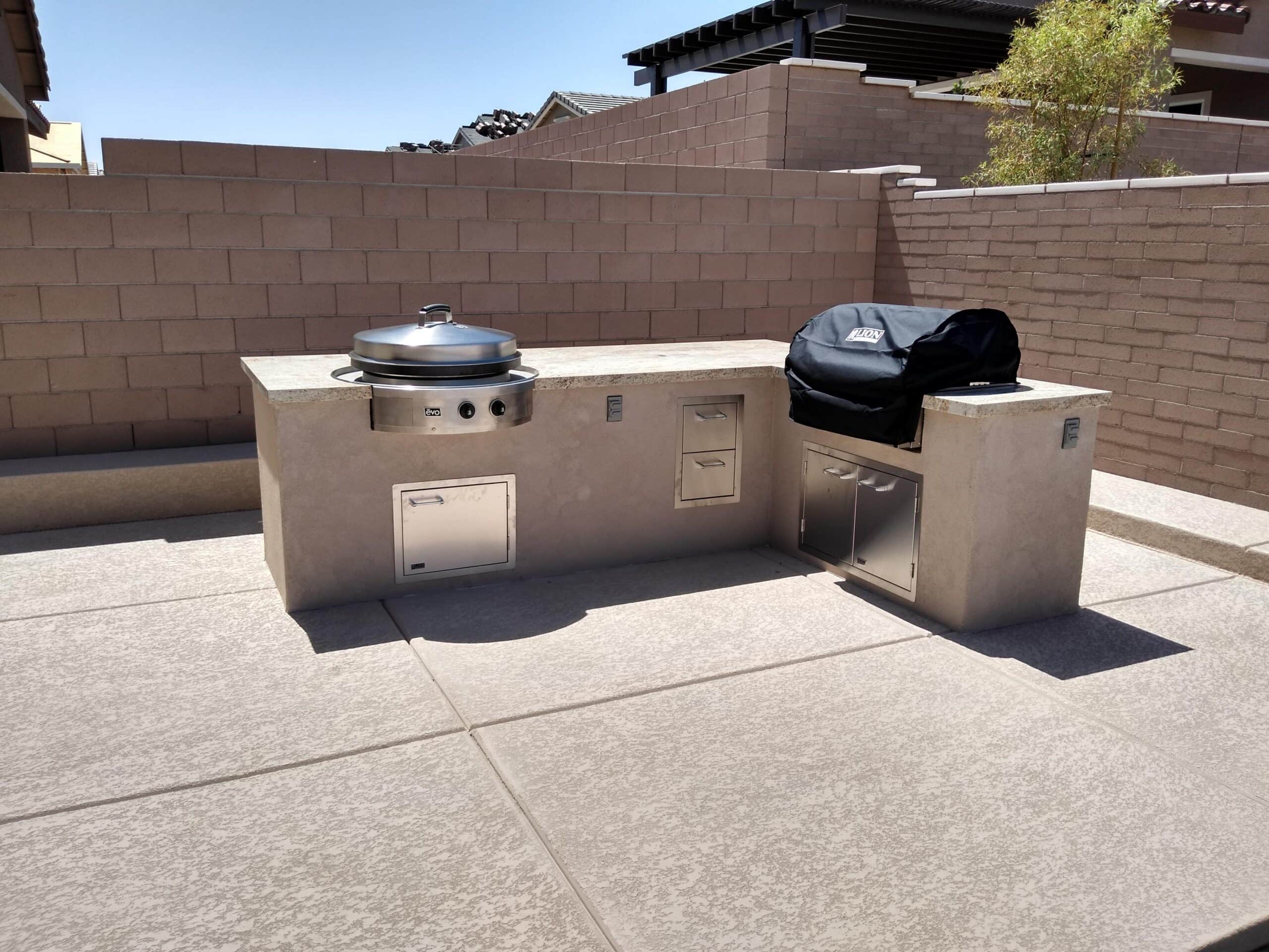 Custom stucco BBQ island with two built-in kamado grills in Las Vegas