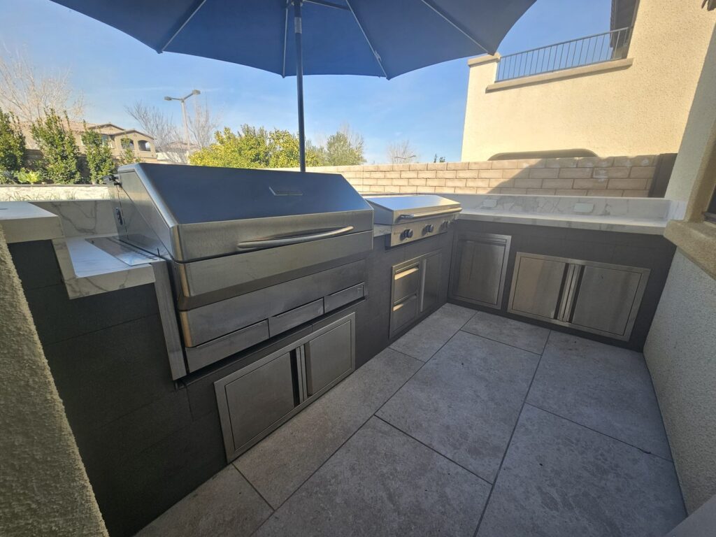 L-shaped outdoor kitchen with Memphis pellet grill and Le Griddle in The Paseos, Summerlin